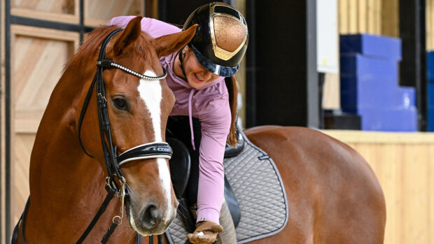 Abi Lye gives Sun Rose (Shirley) a treat during a training session at home.