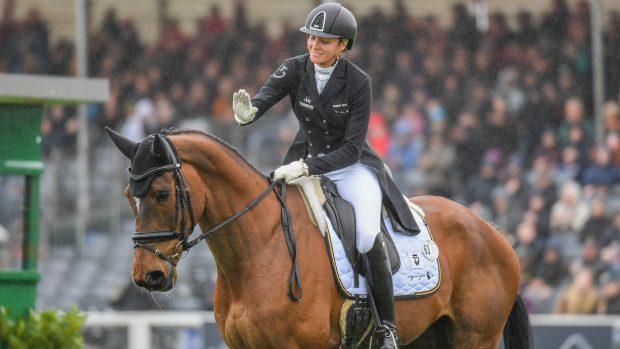 Emily King pats Valmy Biats at Badminton: the horse is bred by Philippe Brivois of Biats Stud