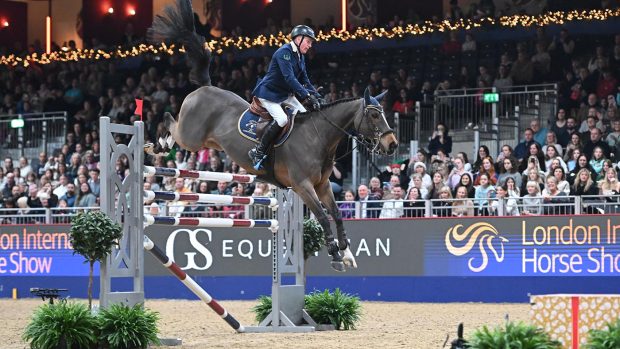John Whitaker and Sharid win the London International Horse Show six bar