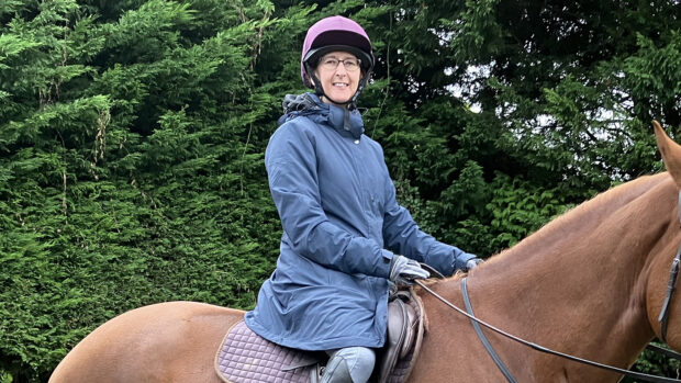 Carol Phillips wearing the Mountain Horse Flash Deluxe Parka while riding