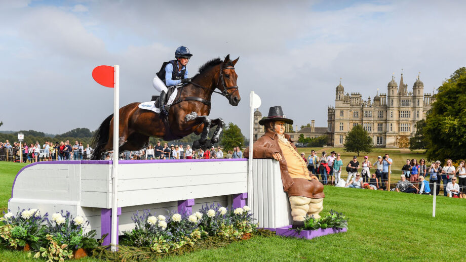 Ros Canter and Lordships Graffalo jump the Lambert's Sofa in front of fans with Burghley Horse in the background at Defender Burghley 2024.