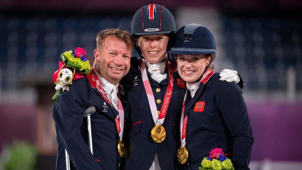 The British team with their gold medals on the podium after the Paralympic dressage team competition at the Tokyo Paralympic Games